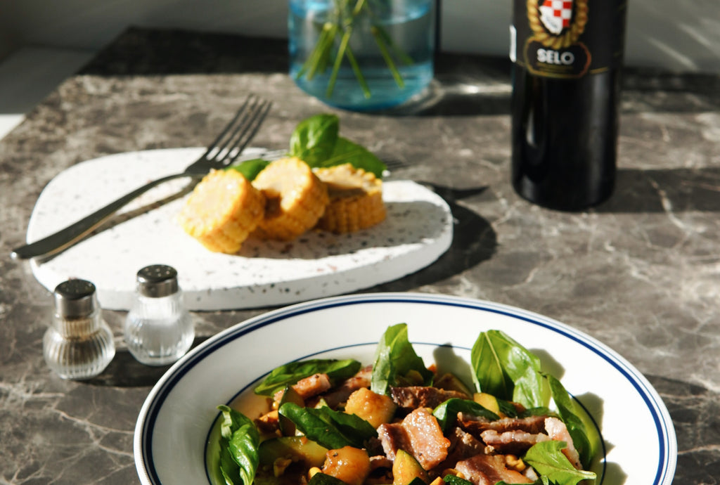 Grilled Summer Squash and Corn Salad with Bacon - A colorful salad with grilled vegetables, crispy bacon, and a tangy dressing.