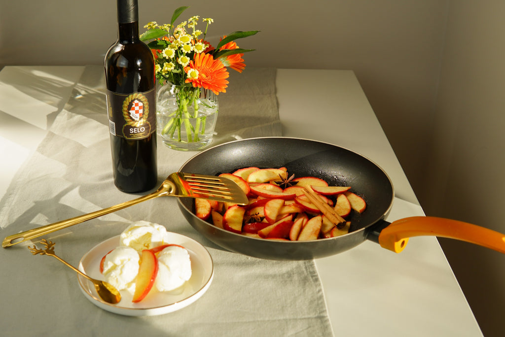 Warm Skillet Apples with Cinnamon, cooked in Croatian olive oil, offering a fragrant and comforting dessert perfect for a cozy evening.